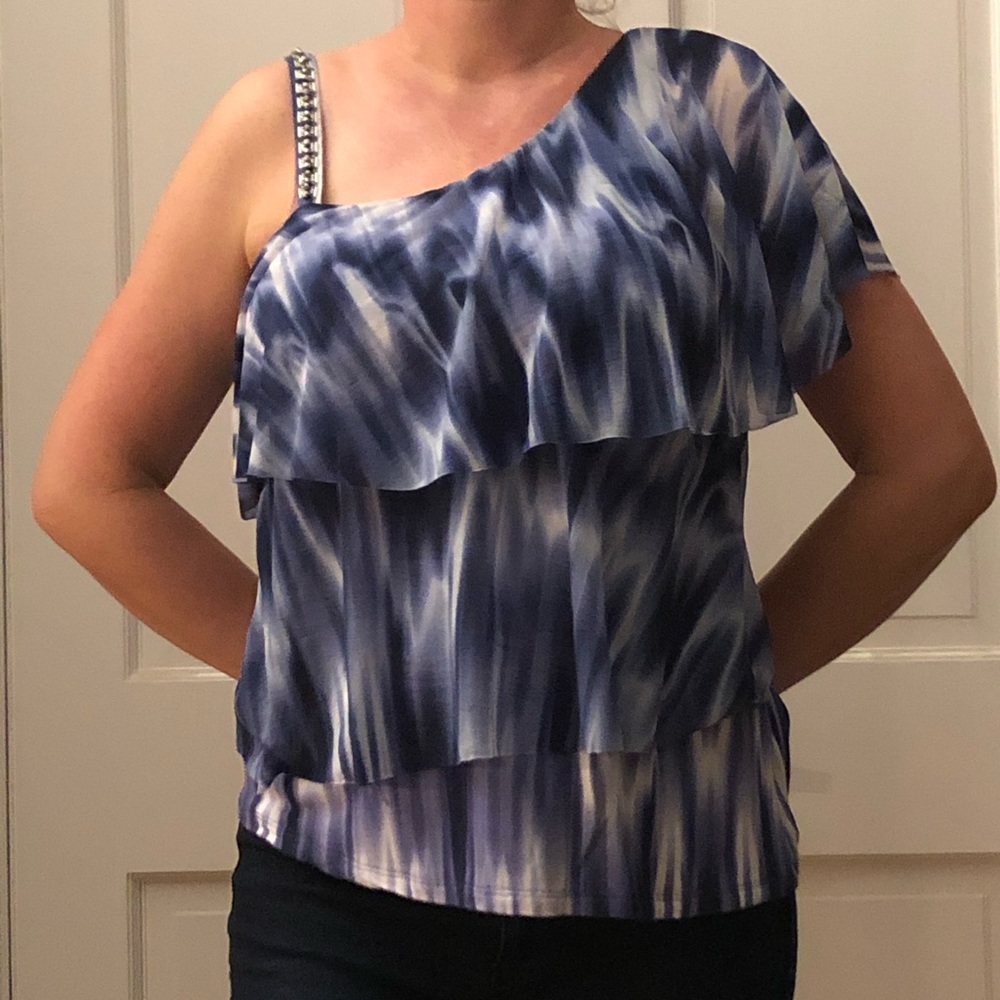 Blouse. Off one shoulder.